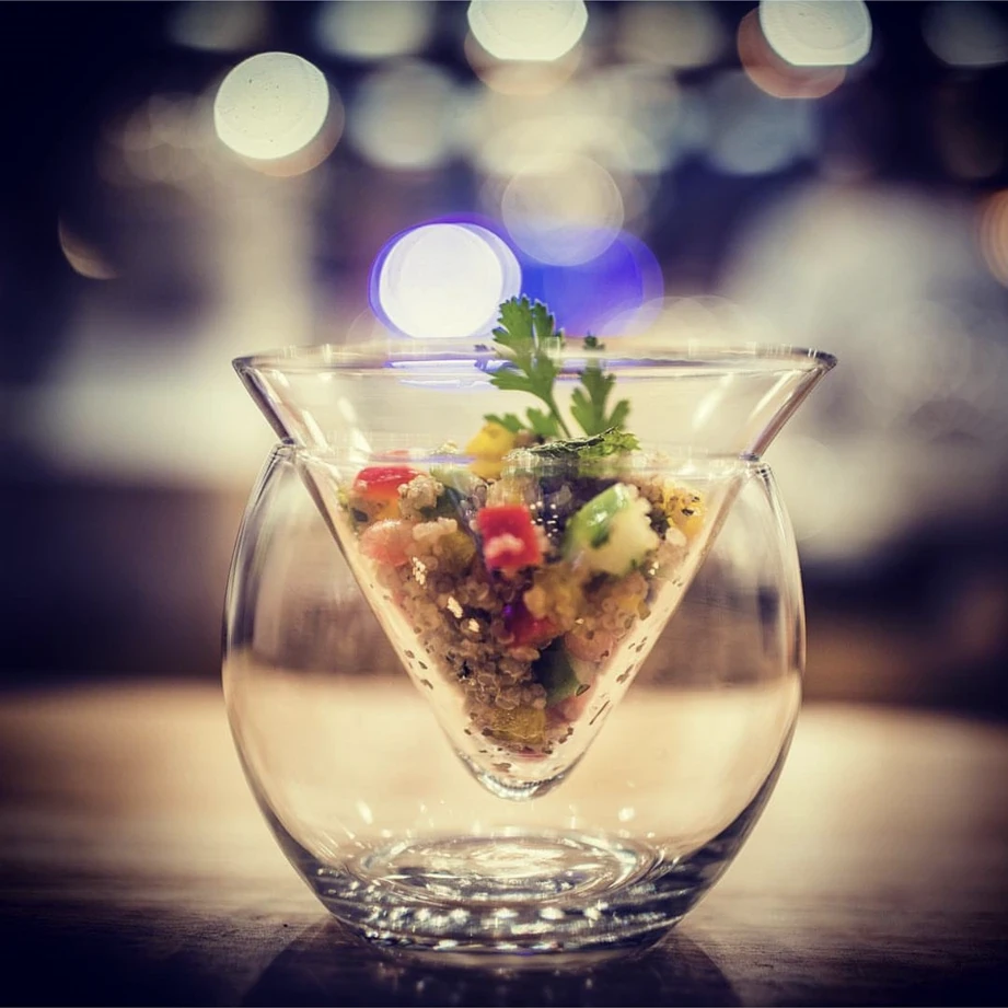A vegan quinoa salad, in a glass.